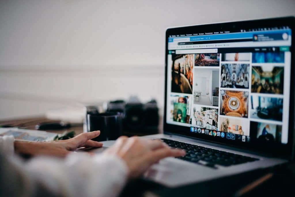 Person researching online marketing strategies for a landscaping business.
